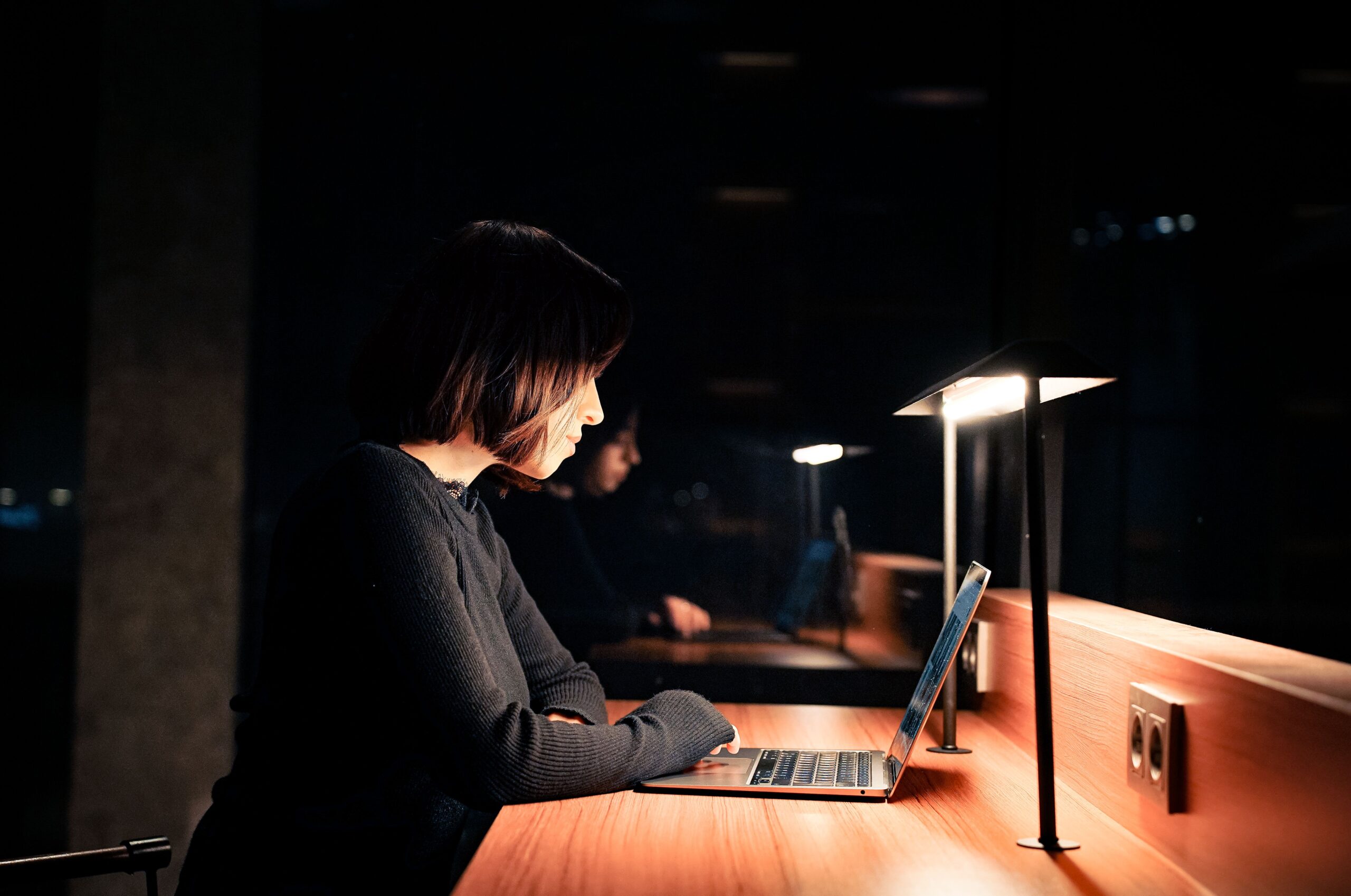 Professional working on a laptop in a modern workspace